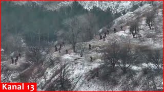 Large group of Russians attacking Bakhmut on snowy roads destroyed in forest