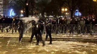 video: Watch pro-Navalny protesters pelt riot police with snowballs in Moscow