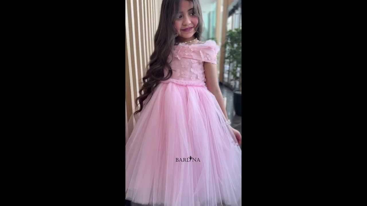 Pink girl's dress decorated with roses on the shoulder - year 1
