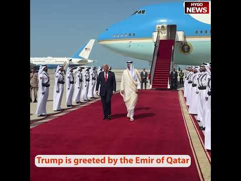 Trump is greeted by Emir Sheikh Tamim bin Hamad Al-Thani at the Amiri Diwan in Doha, Qatar