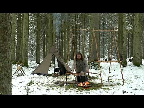 Solo winter bushcraft trip - canvas tent, wood stove, saw horse, cooking tripod, homemade axe etc.