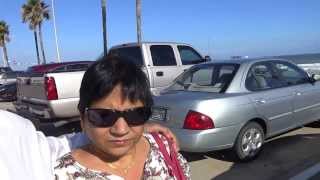 preview picture of video 'Aruna & Hari Sharma walking on Seawall Blvd towards Walmart Supercenter, Galveston TX, Oct 05, 2013'