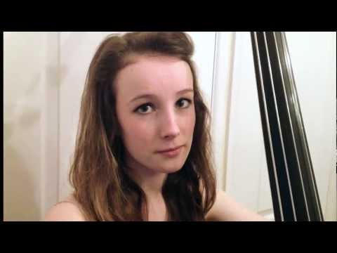 Girl plays double bass wearing only underwear