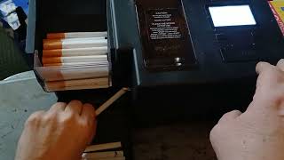 Powermatic V+ automatic cigarette rolling machine.