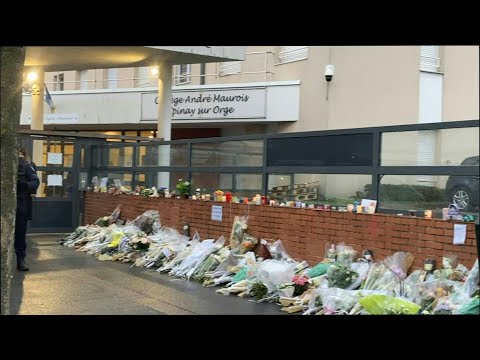 Police and flowers outside school after young schoolgirl found stabbed to death south of Paris | AFP