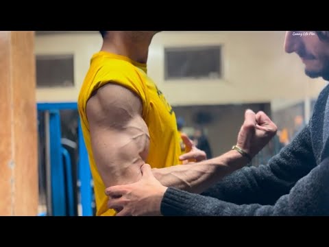 Flexing my super biceps and pressing a guy in my arm lock 