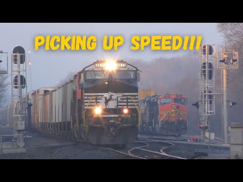 Picking up speed as a 110 car train rolls out of the yard with engines running hard!!!