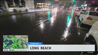 Sandbags line homes as storm sweeps through Long Beach