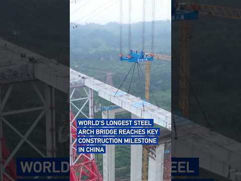 World's longest steel arch bridge reaches key construction milestone in China