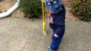 Hayden sweeping the driveway!