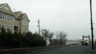 preview picture of video 'NJ Transit, Coast Line Train crossing the bridge in the rain'