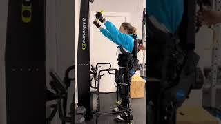Quadriplegic in Ekso bionics exoskeleton using the SkiErg
