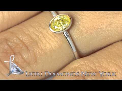 FD-031 - 0.50 Ct. Fancy Yellow Oval Cut Diamond Solitaires Engagement Ring 14k White Gold