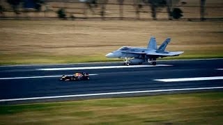 Daniel Ricciardo faces off against an F/A-18 Hornet