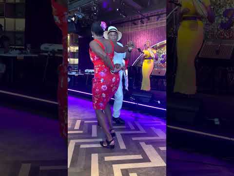 Monica and Errol dancing along with Son Yambu and Naná Clara Aldrin-Quaye playing live music at Soul Mama restaurant