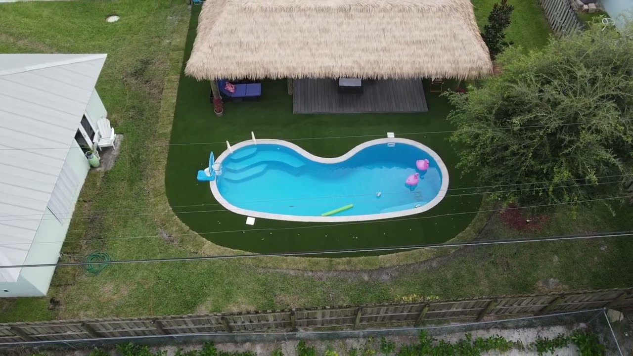 Tropical Oasis Backyard with San Juan Fiberglass Manatee Pool