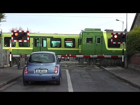 Level Crossing at Sandymount Station, Dublin - IE 8300 + 8520 Class Dart Trains