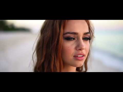 Beautiful girl walking gracefully along a pristine white beach #beachgirl #girl #beachgirls #beach