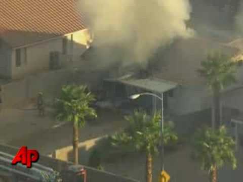 Raw Video:  Aircraft Crashes Crashed Into House