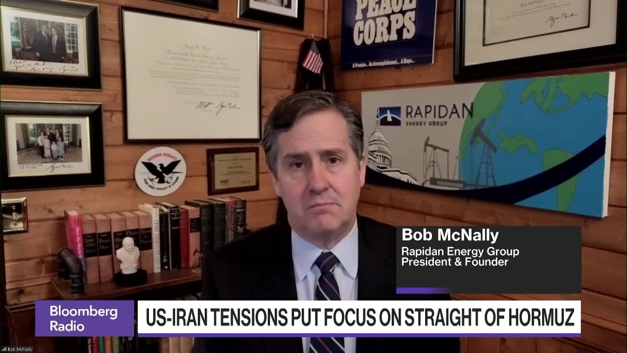 Oil tanker navigating the Strait of Hormuz with a backdrop of a refinery, symbolizing US-Iran tensions and global oil market impact.