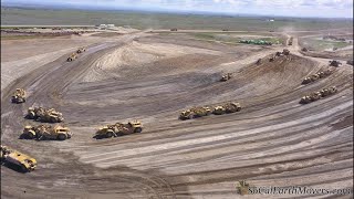 Digging new landfill cell with fleet of Caterpillar scrapers (Part 2)