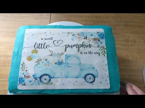 how to apply icing sheet edible image to a cake.