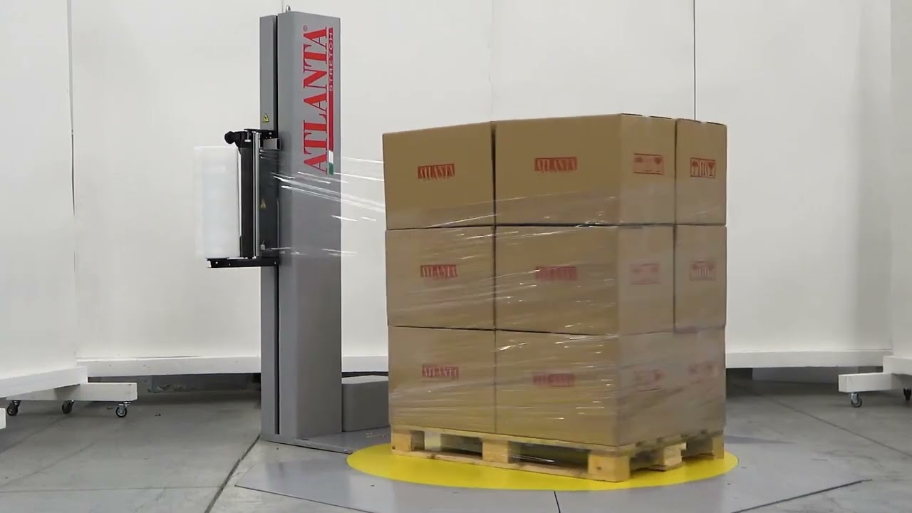 Low profile pallet wrapping machine