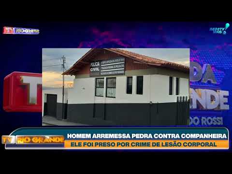 HOMEM ARREMESSA PEDRA CONTRA COMPANHEIRA