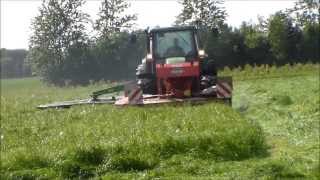 preview picture of video 'John Deere 6910 Mowing with JD/Kuhn mowers in June Denmark 2013'