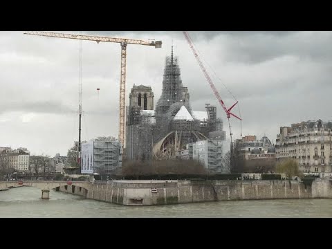 Reconstructed Notre Dame cathedral's spire revealed in Paris after devastating 2019 fire