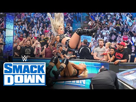 Liv Morgan executes an earth-shattering flying senton on Lacey Evans through a table