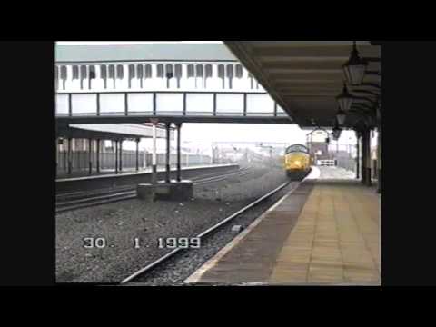 A Class 37 arrives & departs Rhyl Station 30/01/1999