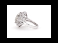 Round cut stone intricately set in a platinum ring