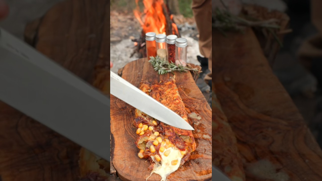 The Ultimate Campfire Cheesy Potato & Egg Feast! 🤤🔥 . #cooking #campfiremagic #wildernesscooking