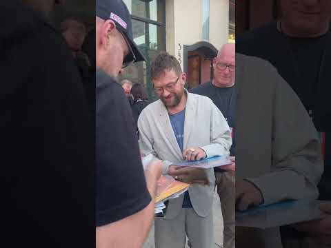 Damon Albarn of Blur signs fan merch in Pomona, CA April 10, 2024