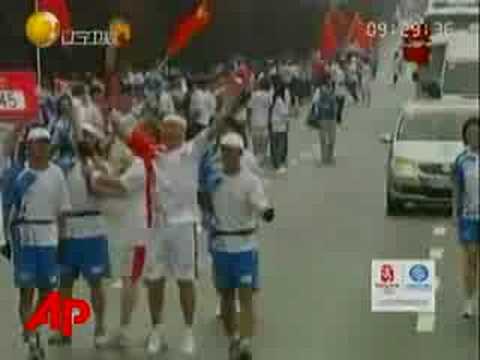 Raw Video: Gold Medalist Carries Olympic Torch