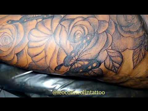 tatuagem de borboleta em pele morena rosas tattoo Leo Colin tattoo floral