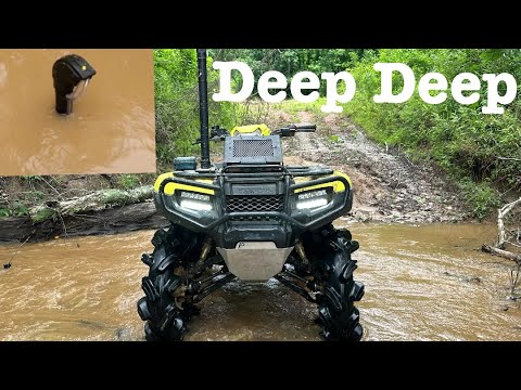 Honda rubicon on crushlocks going deep deep after flood(top of snorkel)