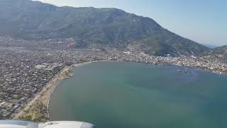 preview picture of video 'Cap-Haïtian take off view of city and mountains'