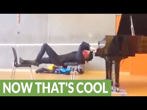 VIDEO OF THE DAY: Playing the piano upside down and blindfolded