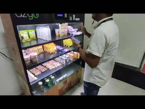 azgo aap! buying a snacks from automatic vending machine