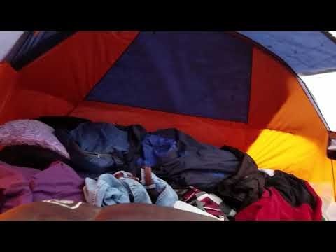 Snuggling through the rain in the tent.