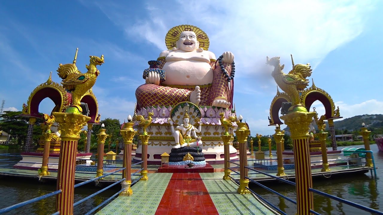 Experience the mesmerizing beauty of Wat Plai Laem on foot in this captivating video.