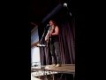 John Flynn performs "Dragon" at the One World Coffeehouse