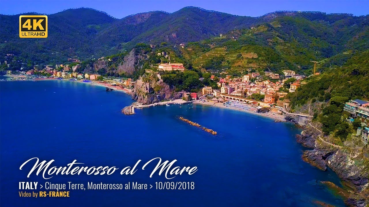 Explore Monterosso village, contrast public and private beach areas, discover swimming spots, and immerse in the coastal experience of Cinque Terre.