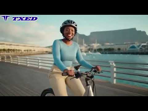 Rider standing with TXED electric share bike at Cape Town Waterfront with Table Mountain in the background