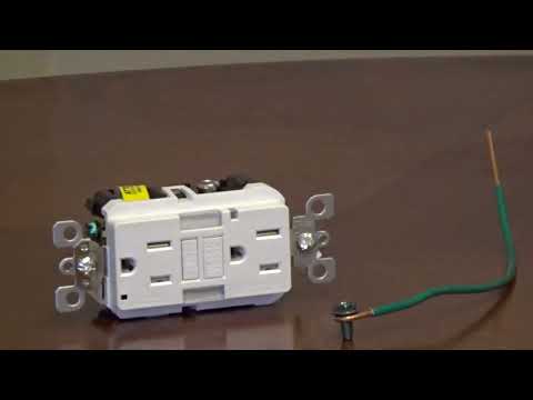 Part of a video titled What is a Self Grounding Clip on an Outlet - YouTube