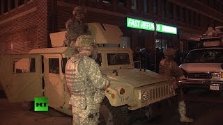 Soldiers, riot police patrol Baltimore amid mandatory curfew