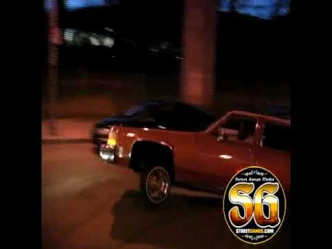 Two Cadillac Lowriders hitting Three Wheel motion in a circle