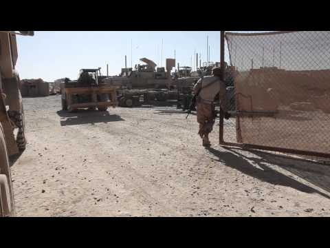 Two Texas Marines build medical tables for Afghan medics